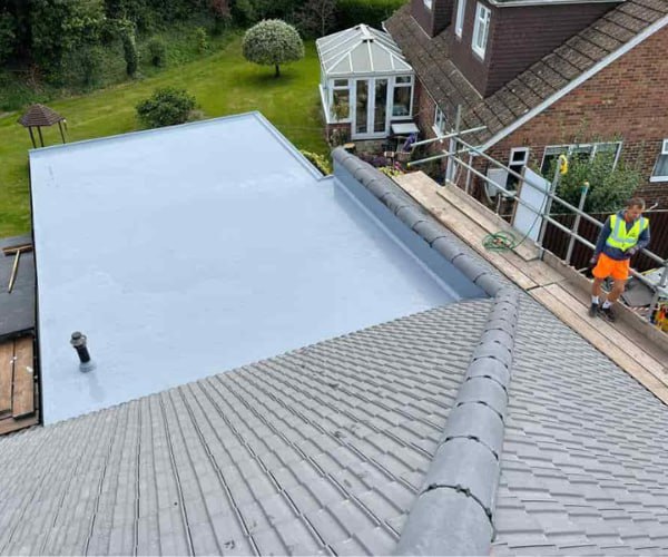 This is a photo of a newly installed hip roof, with a combined liquid covered flat roof. Work carried out by WDF Roofing St Neots