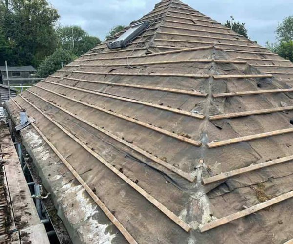 This is a photo of a hip roof that has been stripped back to the battens, and is awaiting a new roof covering to be installed. Works carried out by WDF Roofing St Neots